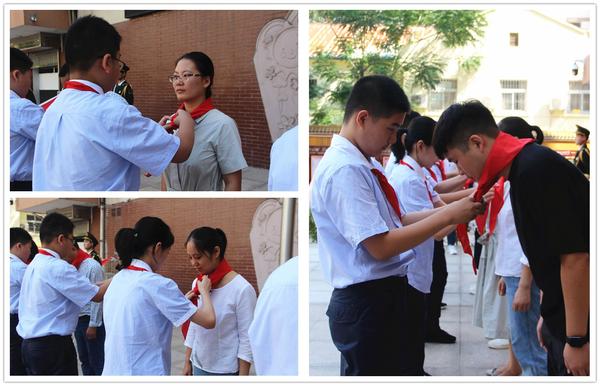 学生代表为辅导员老师戴上鲜艳的红领巾